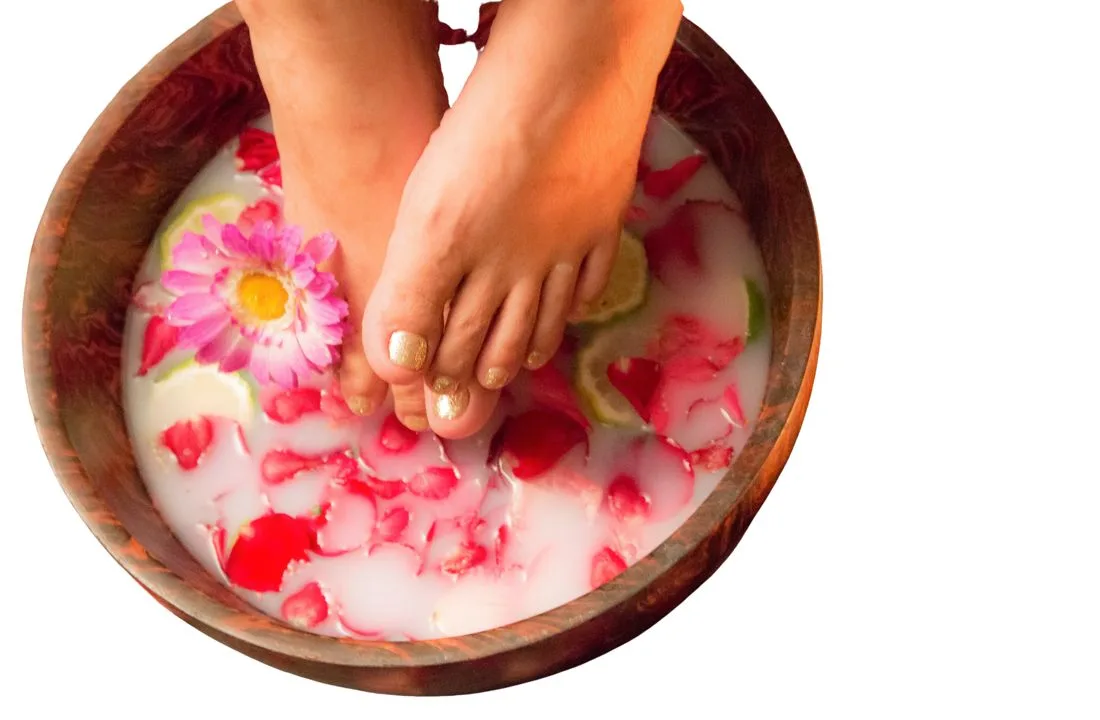 Feet resting in a warm flower foot soak