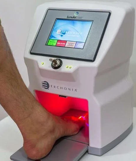 Foot placed in the Lunula cold laser device