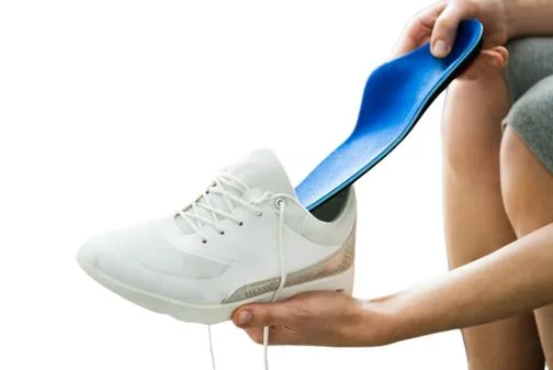 Custom orthotic insole going into a running shoe
